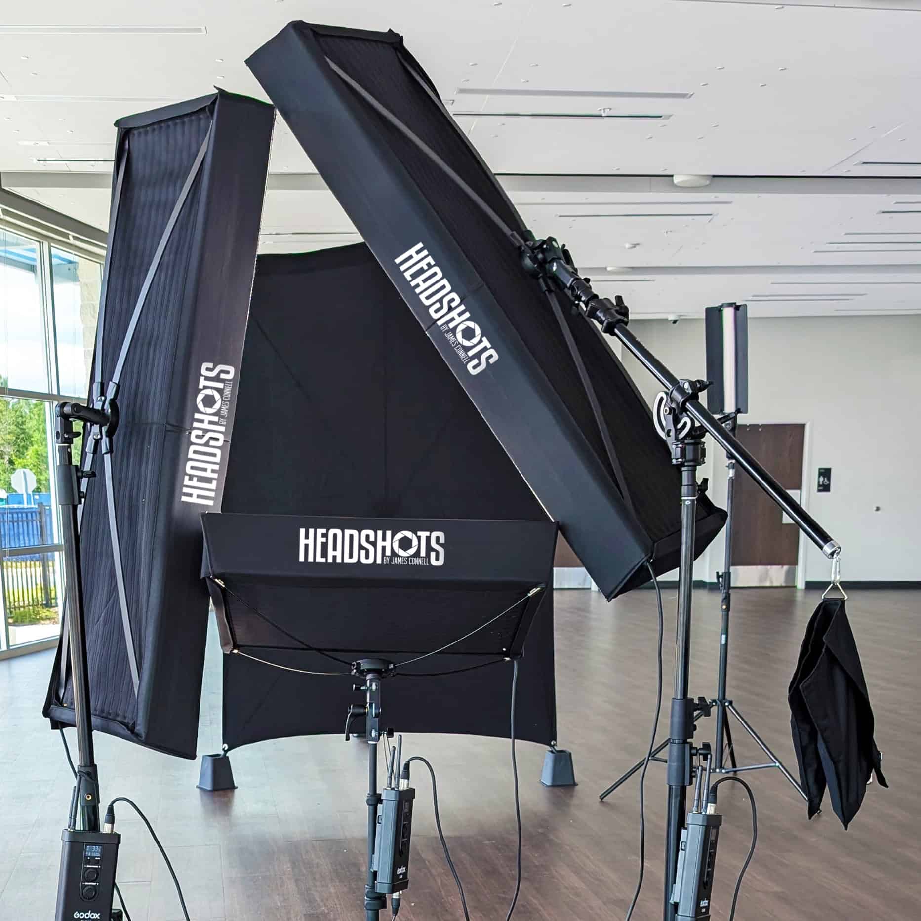 Mobile headshot studio lighting kit setup in a Tampa office conference room