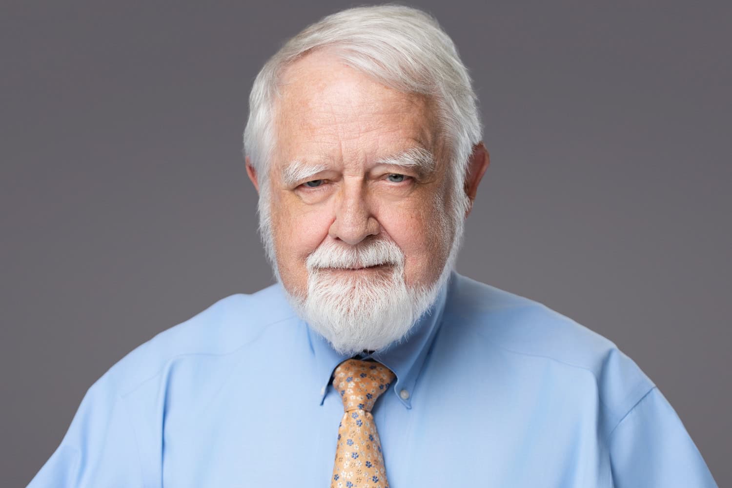 Corporate headshot Tampa for Cushman & Wakefield executive embracing age with confidence