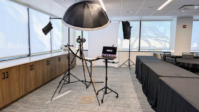 A professional mobile corporate headshot booth setup in action for an Event Activation Tampa at a local corporate office.