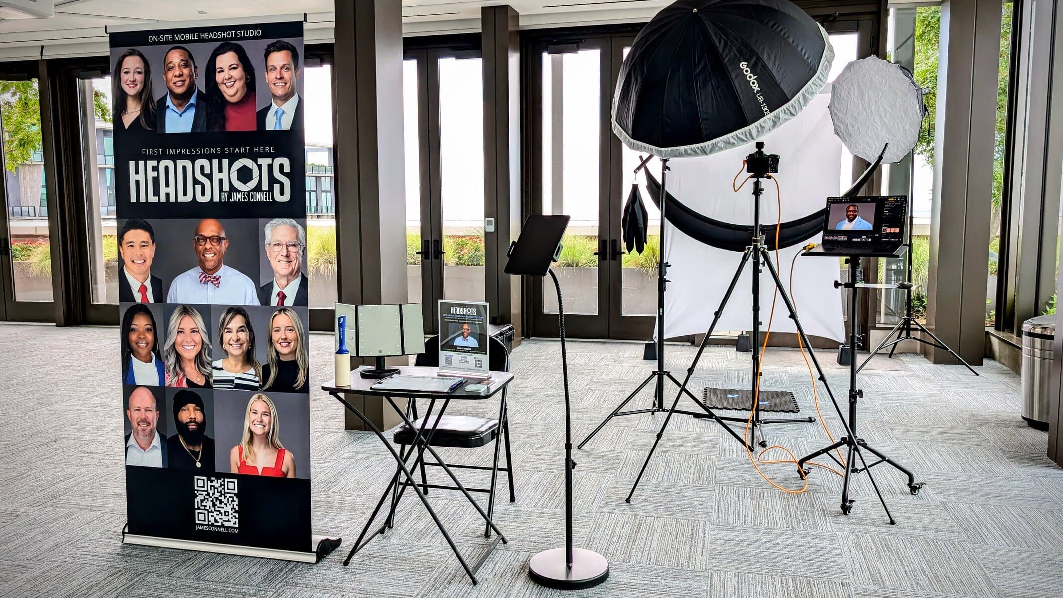 Professional Headshot Booth Lakeland setup with lighting and instant review station at a corporate event.