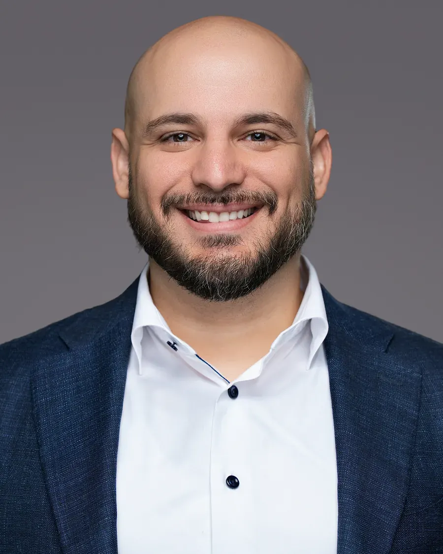 Business man in a black blazer with an open collar, Tampa headshot