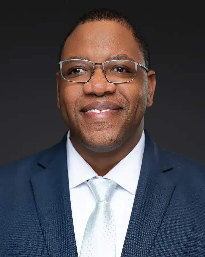 Corporate man in a navy suit and glasses, Tampa corporate headshot