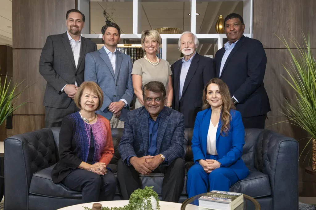 Corporate team group photo in an office lounge, on-site Tampa Bay team headshots