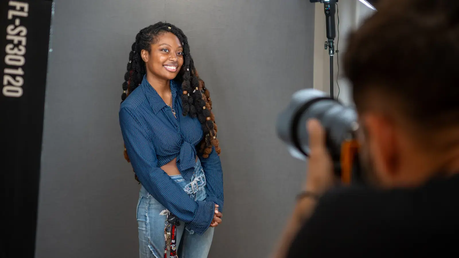 Tampa headshot photographer shooting a client on a gray backdrop in the Ybor City studio