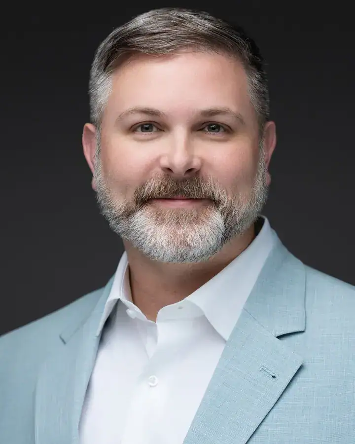 Professional man with a beard in a light blue blazer, Tampa headshot