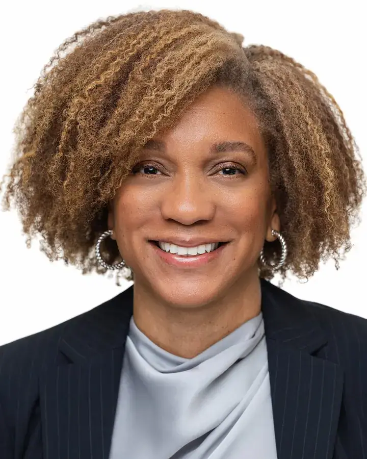 Professional woman with curly hair on a white background, Tampa headshot
